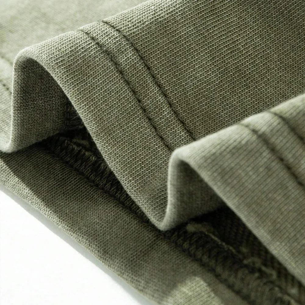 Close-up of a garment-dyed cotton hem and coverstitch